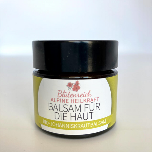 Glas mit Jonniskrautölbalsam in braunem Lichtschutztiegel.